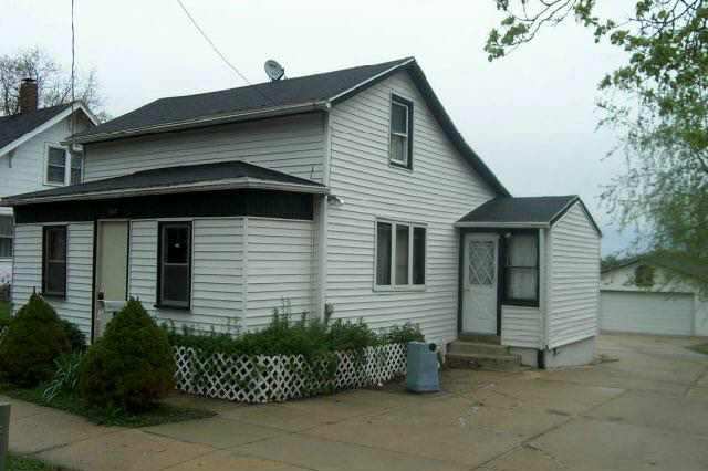 207 Washington Street Ridott, IL 61067 - Photo 2 of 8 a view of a house with a garage