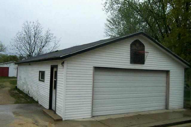207 Washington Street Ridott, IL 61067 - Photo 6 of 8 a front view of a house with garage