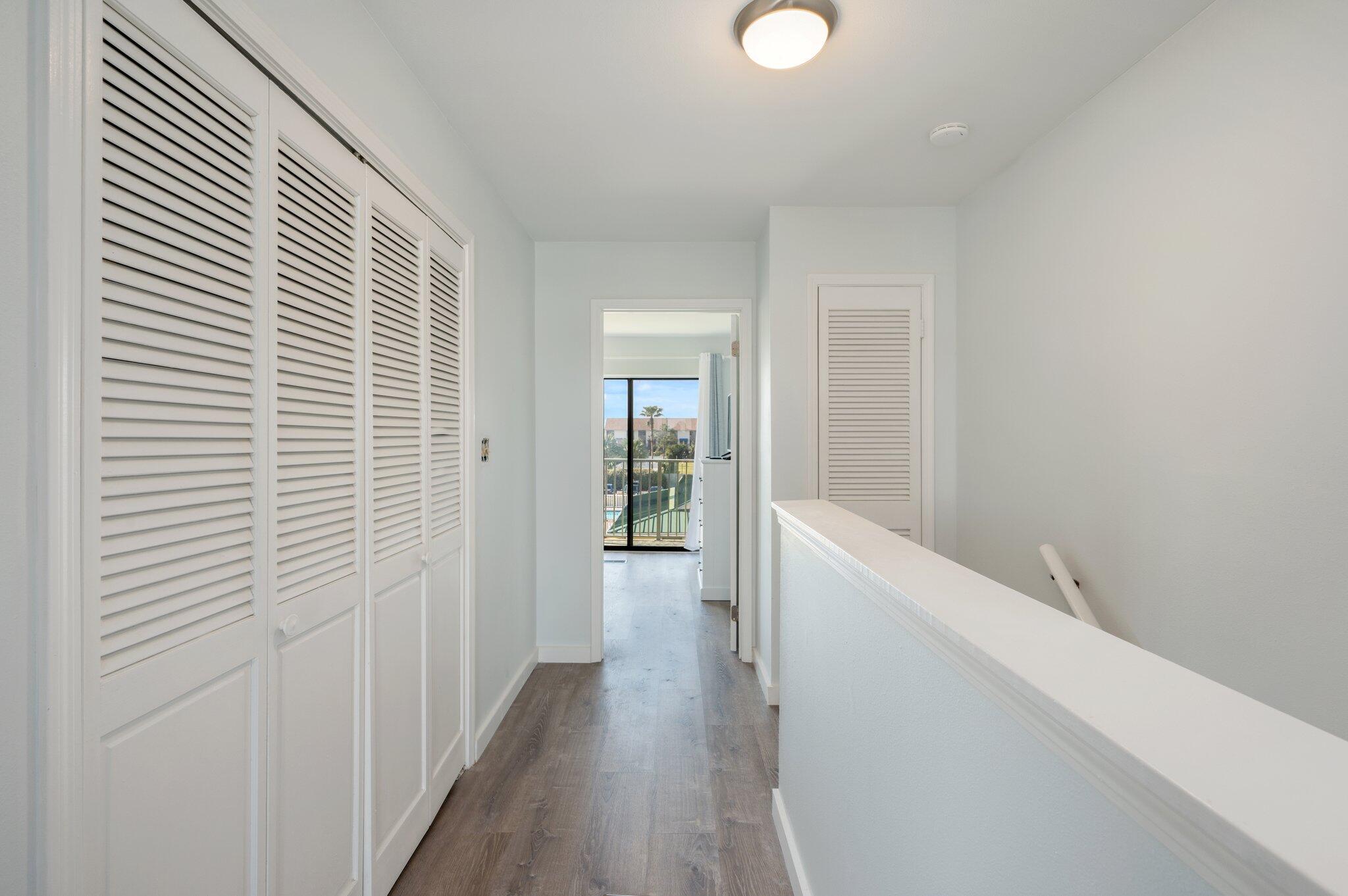 60 Sandprints Drive, Unit C6 Miramar Beach, FL 32550 - Photo 14 of 28 a view of a hallway with wooden floor and staircase