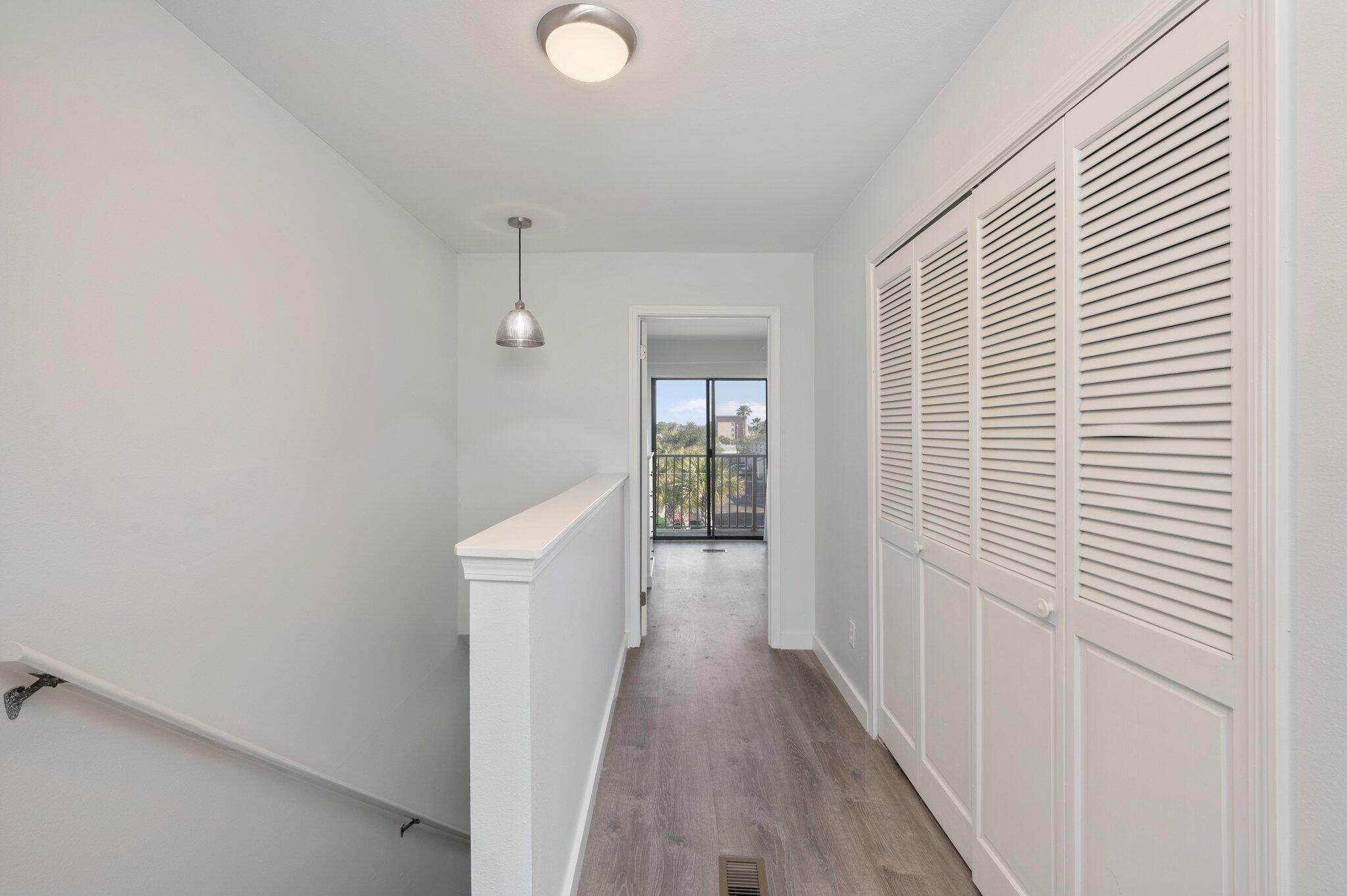 60 Sandprints Drive, Unit C6 Miramar Beach, FL 32550 - Photo 20 of 28 a view of a hallway with wooden floor and cabinets