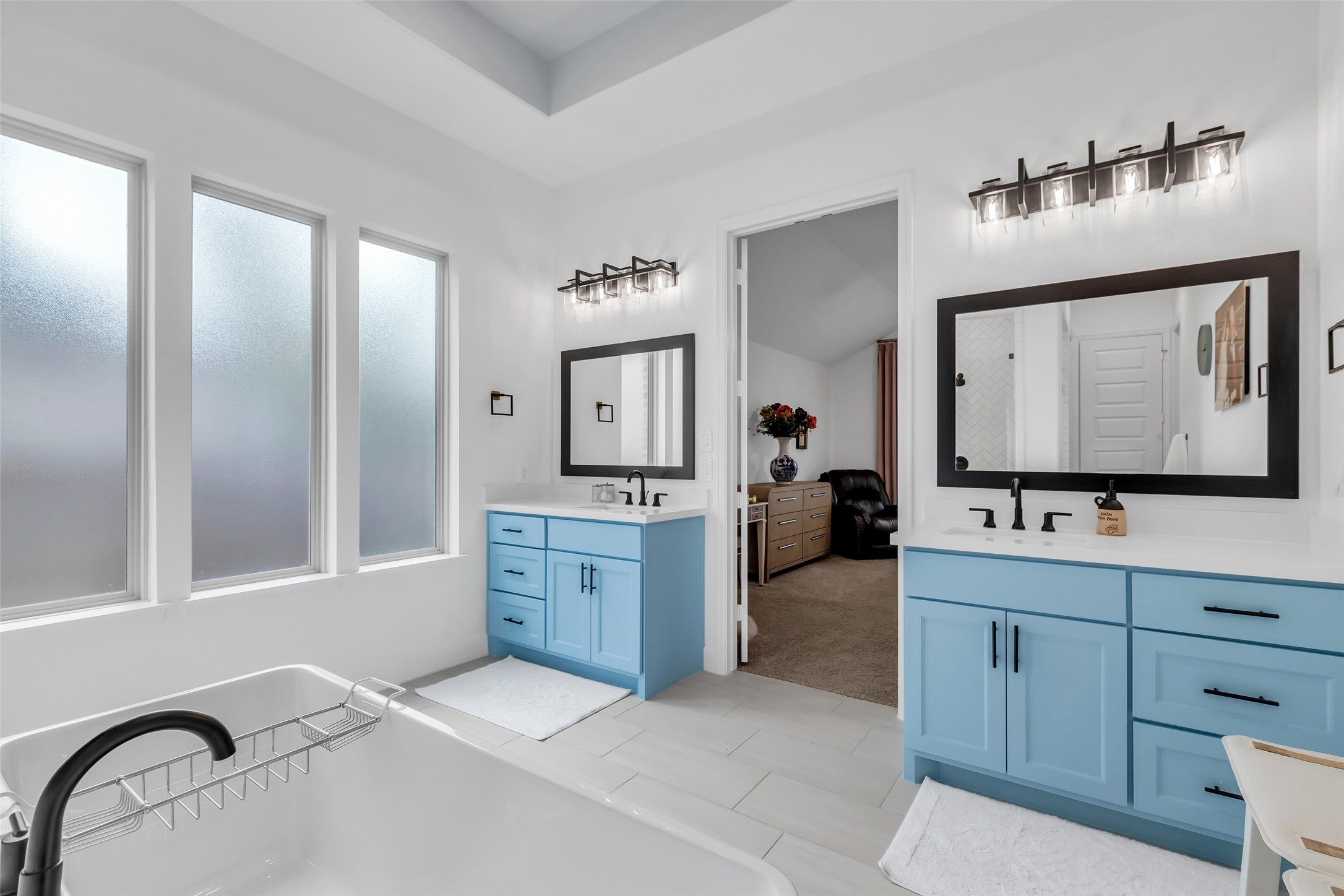 633 North Rivus Overlook Drive Willis, TX 77318 - Photo 18 of 28 a spacious bathroom with a double vanity sink and mirror