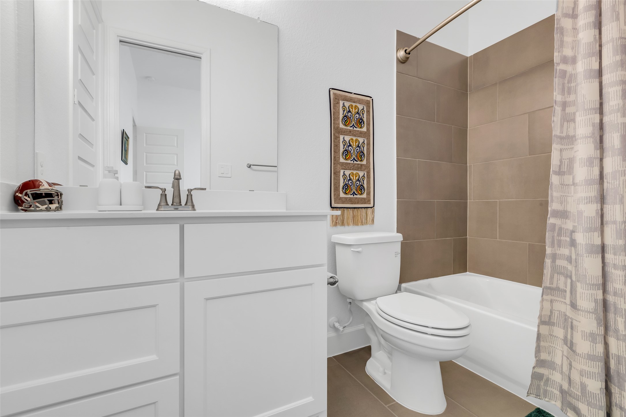 633 North Rivus Overlook Drive Willis, TX 77318 - Photo 21 of 28 a bathroom with a toilet sink vanity and mirror