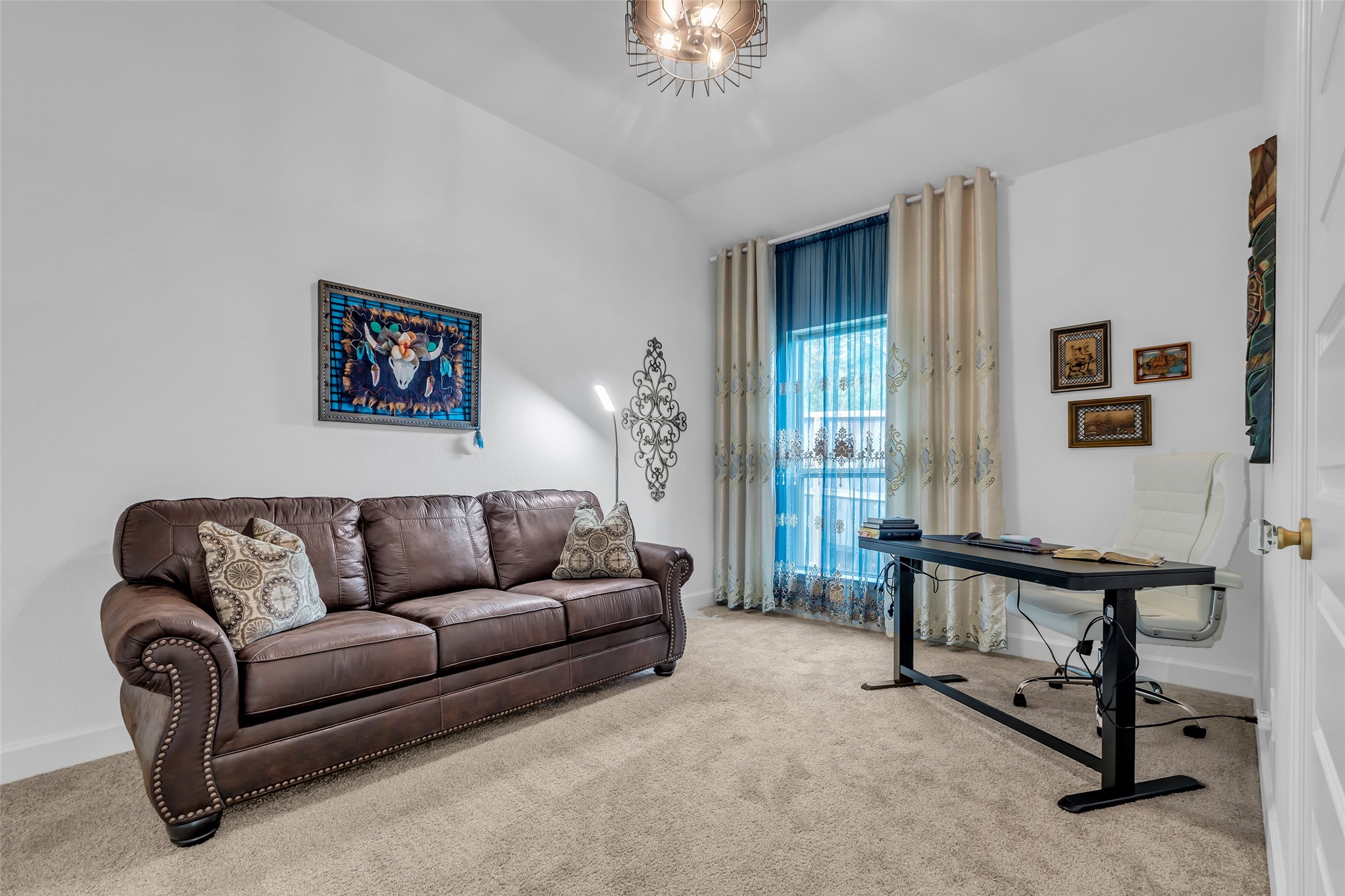 633 North Rivus Overlook Drive Willis, TX 77318 - Photo 22 of 28 a living room with furniture and a chandelier