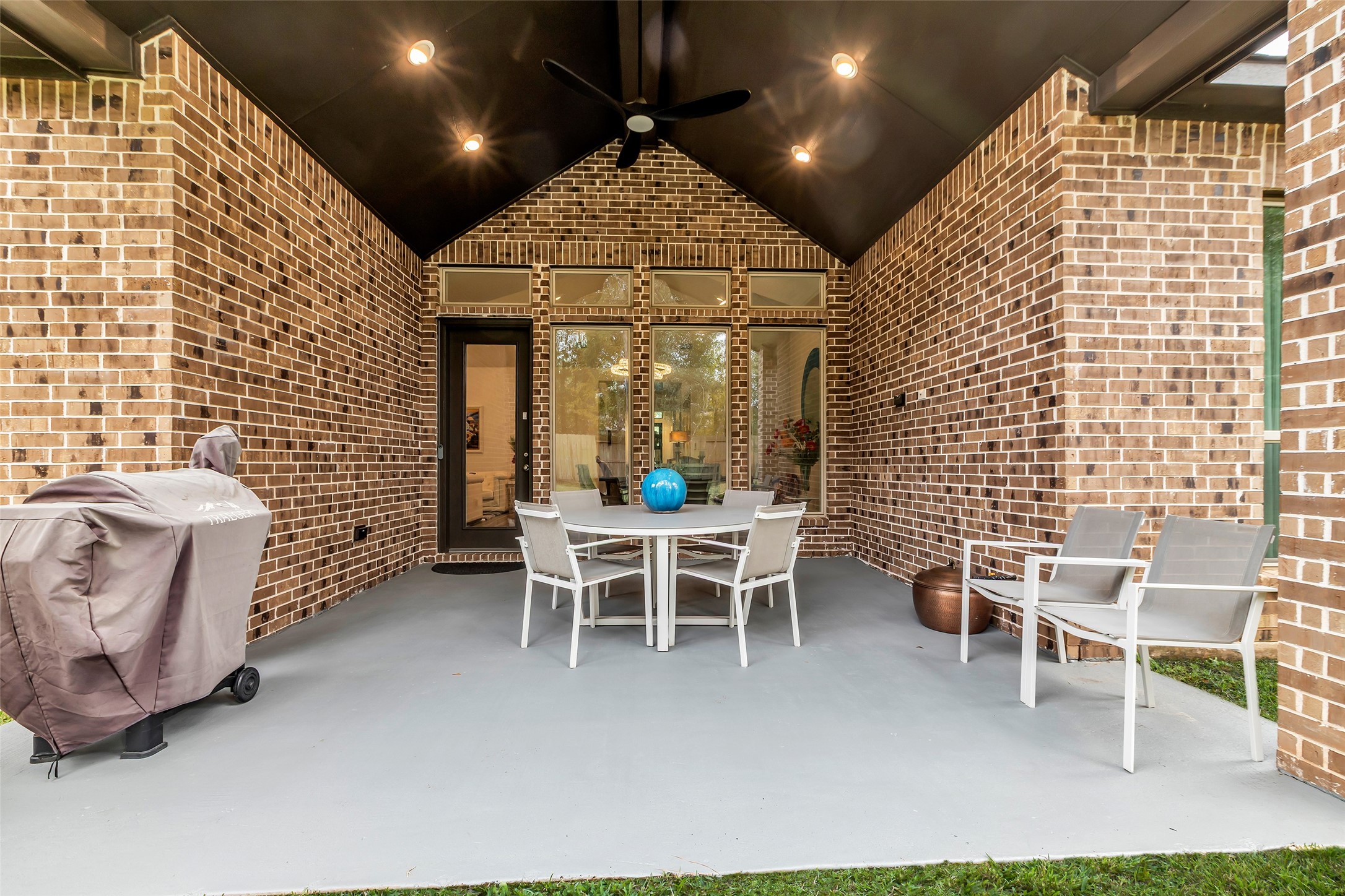 633 North Rivus Overlook Drive Willis, TX 77318 - Photo 26 of 28 a dining room with furniture and a chandelier
