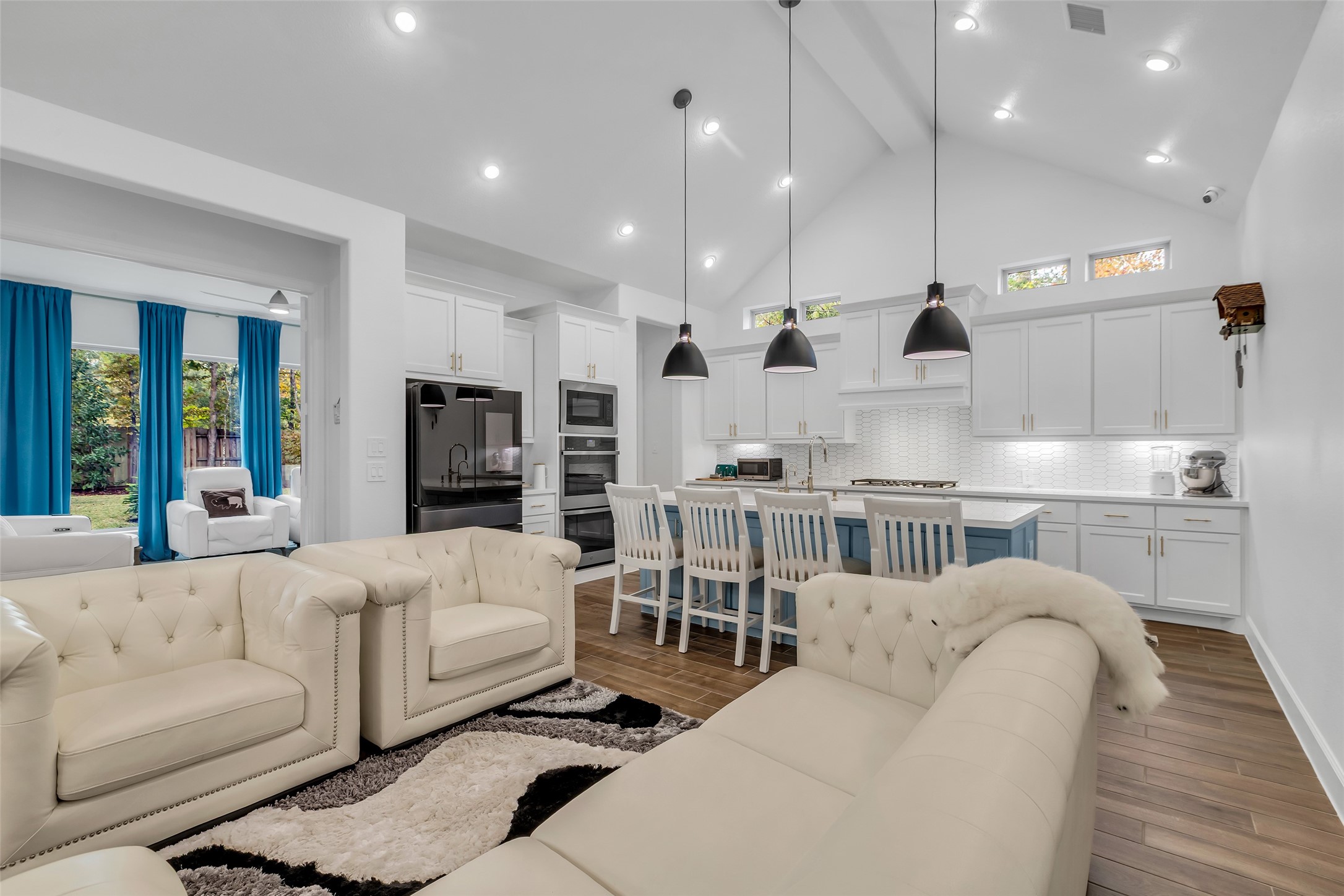 633 North Rivus Overlook Drive Willis, TX 77318 - Photo 10 of 28 a large room with stainless steel appliances kitchen island granite countertop a living room view and furniture