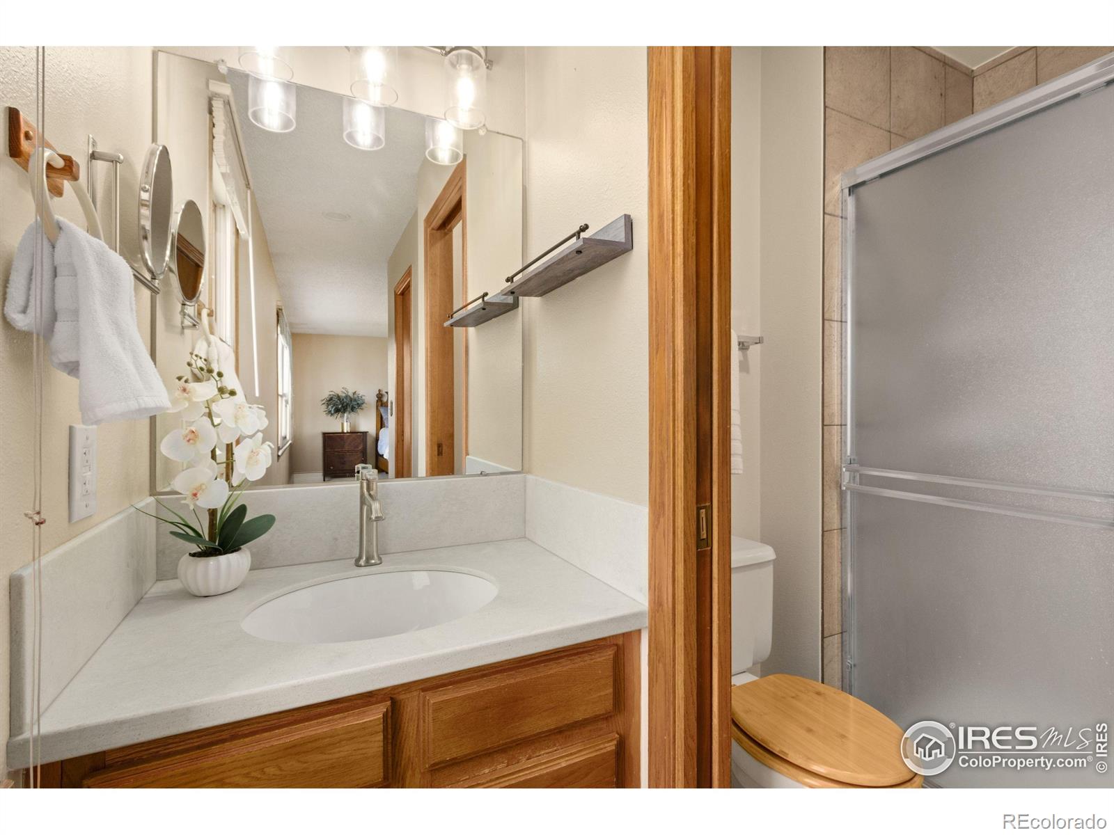 3367 Dudley Way Fort Collins, CO 80526 - Photo 13 of 29 a bathroom with a sink and a mirror