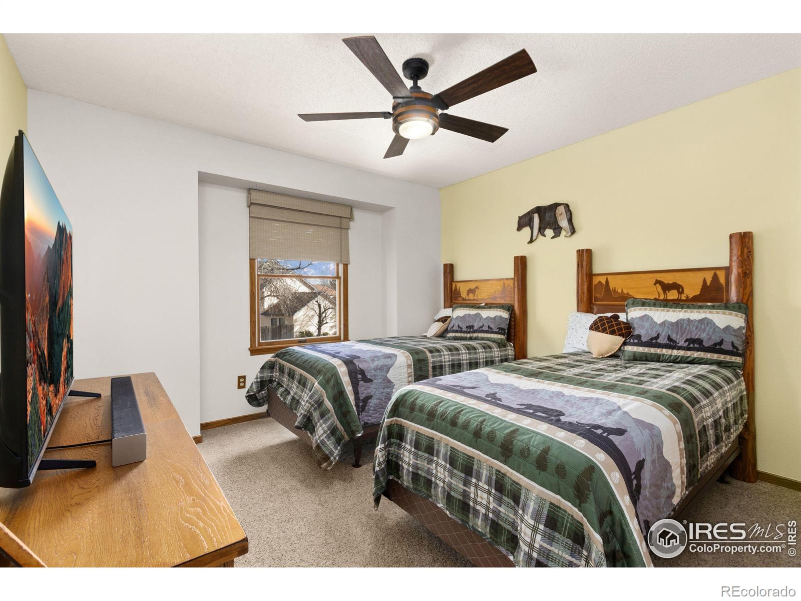 3367 Dudley Way Fort Collins, CO 80526 - Photo 14 of 29 a bedroom with a bed and a flat screen tv