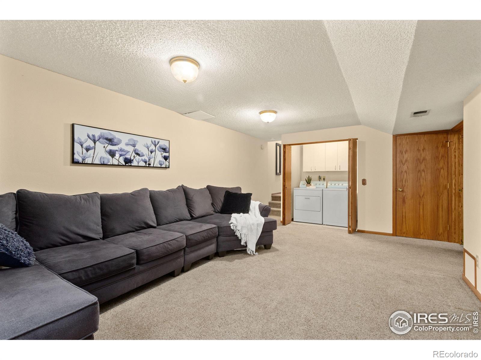 3367 Dudley Way Fort Collins, CO 80526 - Photo 18 of 29 a living room with furniture and a large window