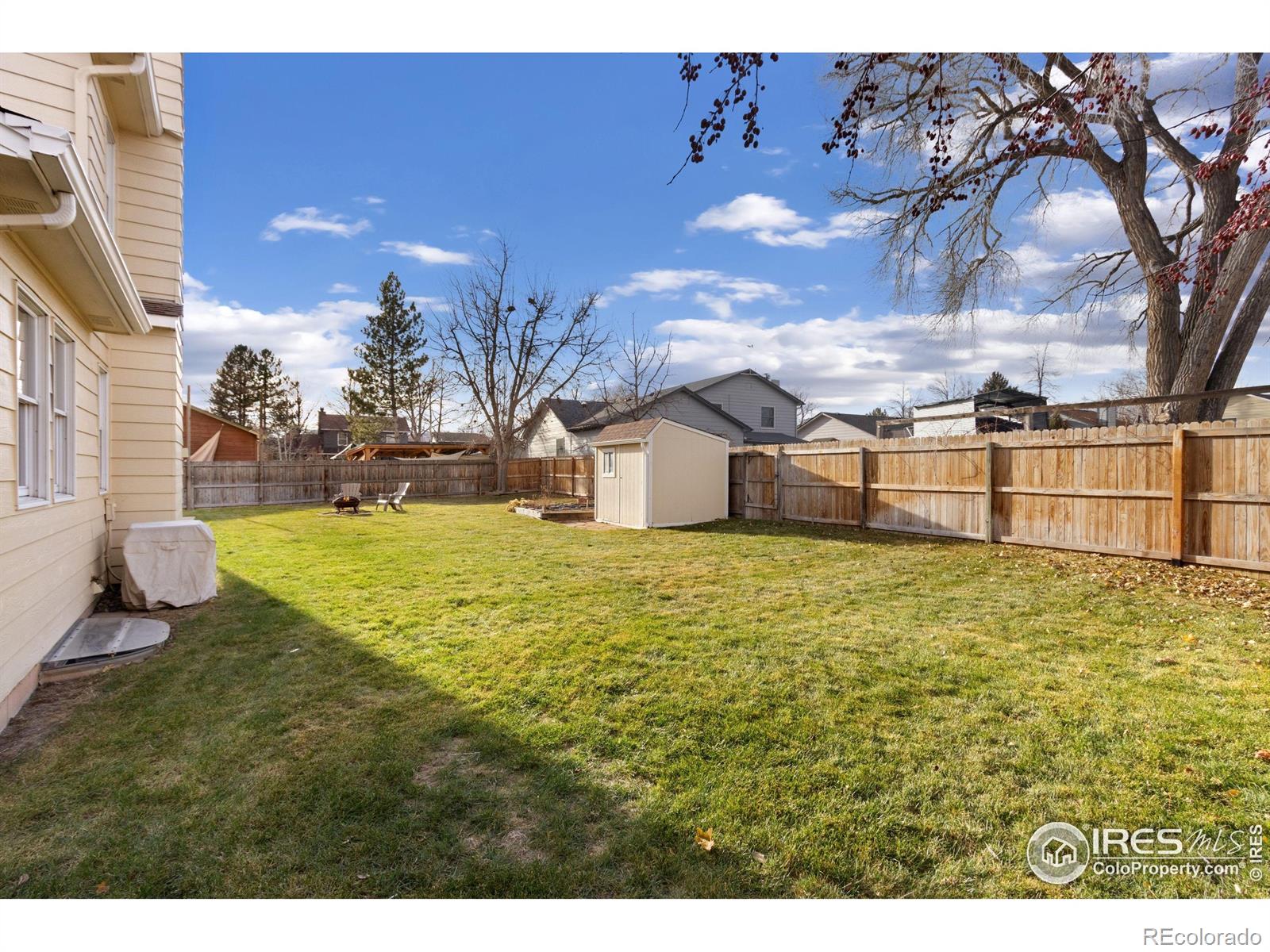 3367 Dudley Way Fort Collins, CO 80526 - Photo 24 of 29 a view of a house with a yard