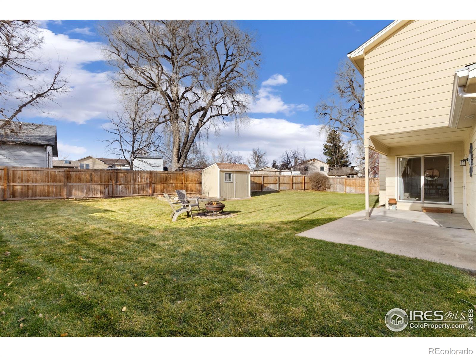 3367 Dudley Way Fort Collins, CO 80526 - Photo 25 of 29 a view of a house with a yard