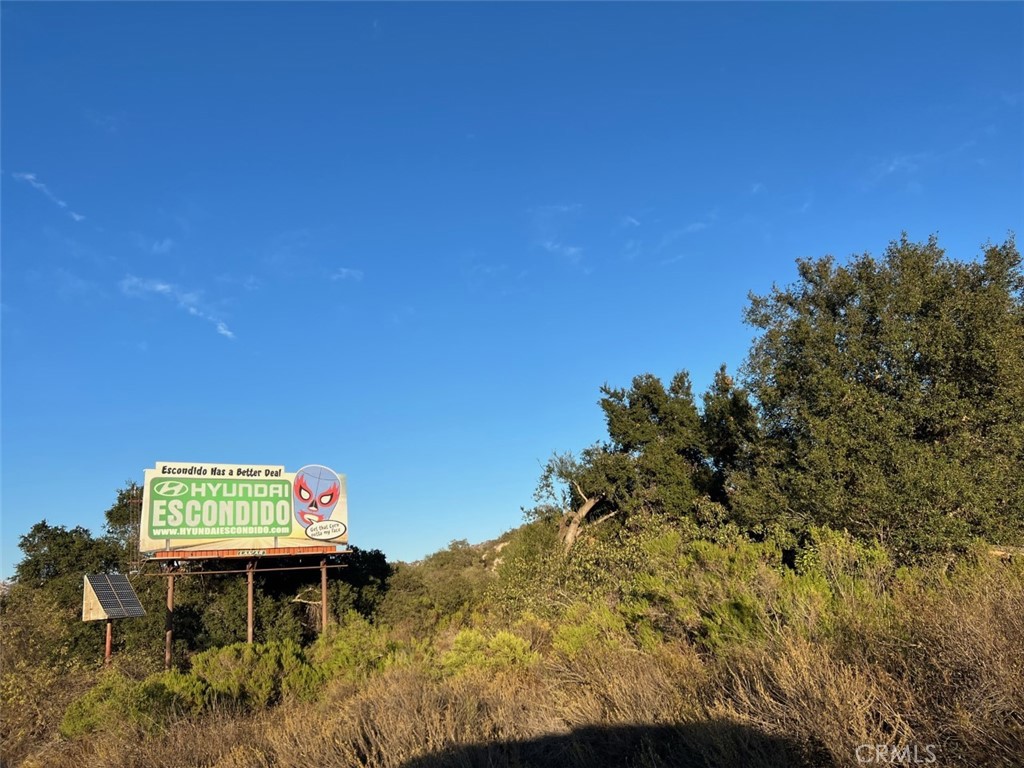 a view of a chairs and table in a backyard