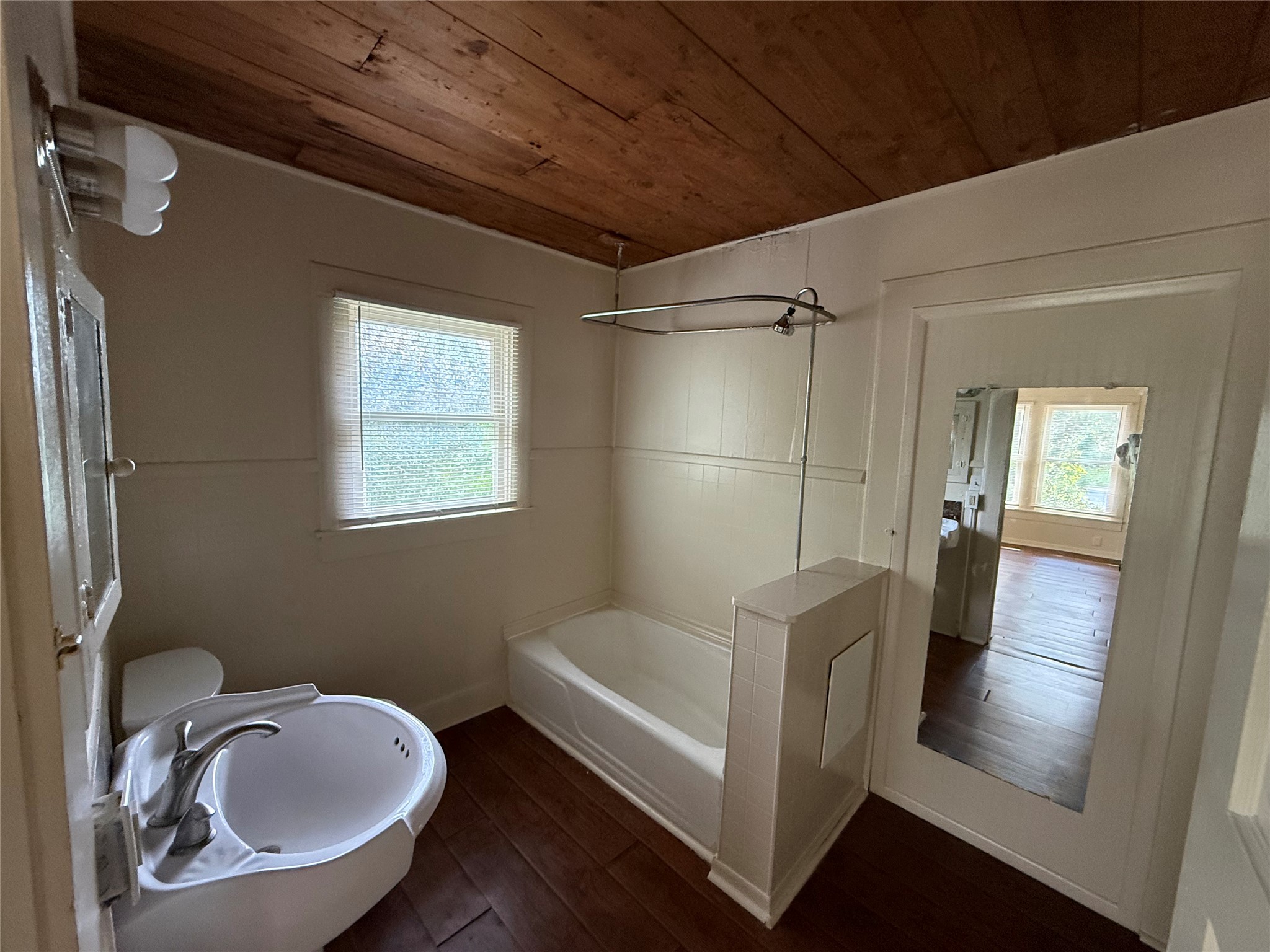 2812 Angier Road Huntsville, TX 77340 - Photo 5 of 6 a bathroom with a sink and mirror