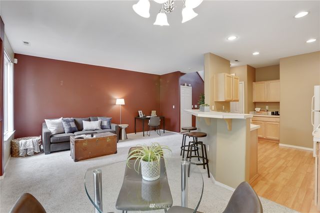 a kitchen that has a sink a stove and window