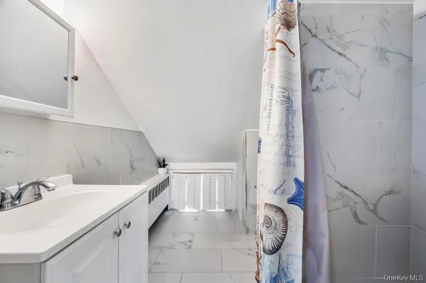 a bathroom with a sink and mirror