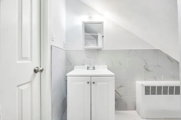 a bathroom with a sink a mirror and vanity