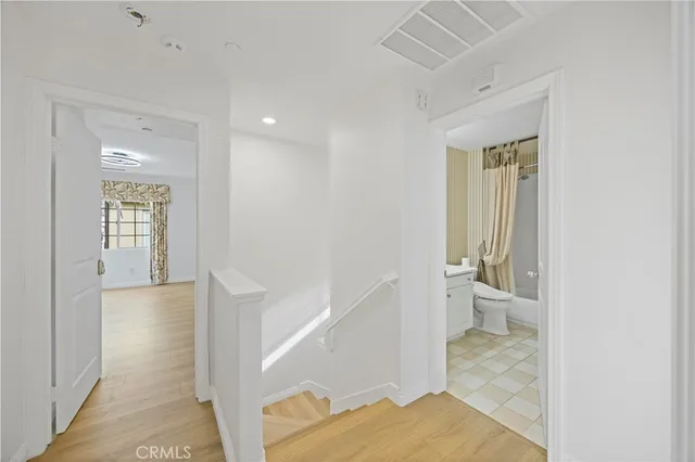 a bathroom with a toilet sink and shower
