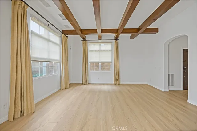 a kitchen with granite countertop a sink and dishwasher with wooden floor