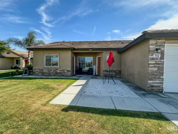 a view of a backyard with swimming pool