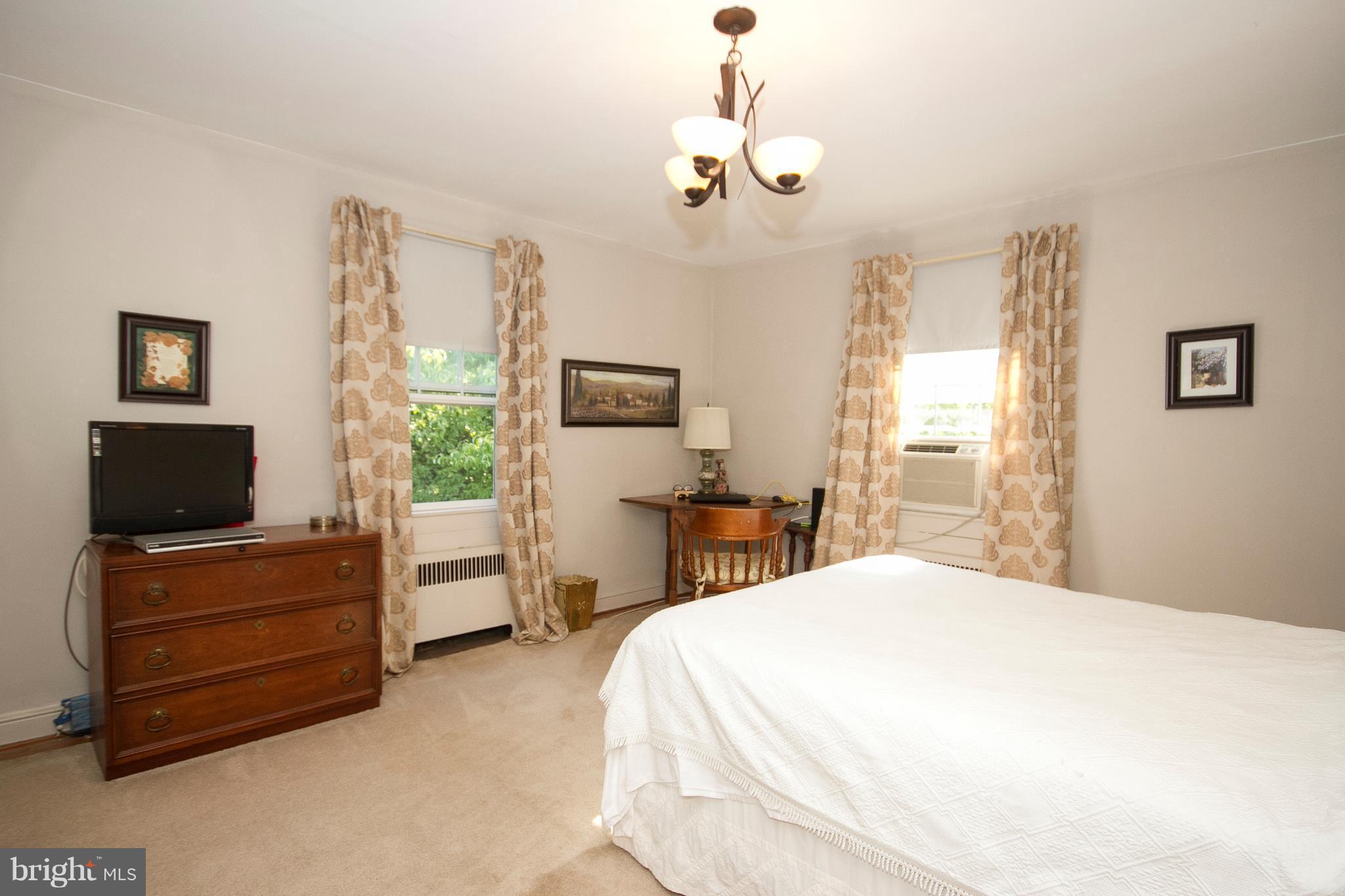 601 Dunkirk Road Baltimore, MD 21212 - Photo 11 of 22 a bedroom with a bed and wooden floor