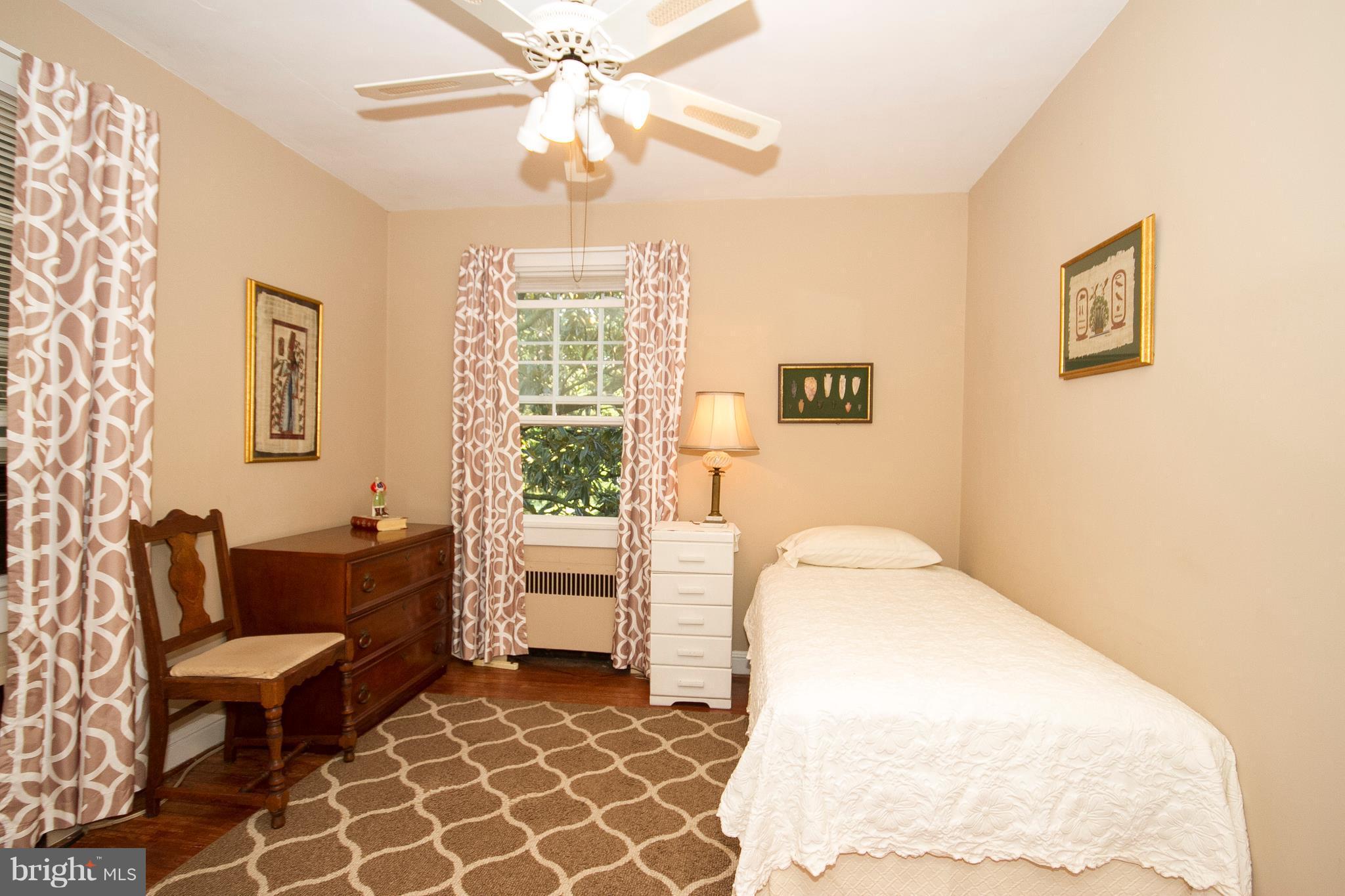 601 Dunkirk Road Baltimore, MD 21212 - Photo 15 of 22 a spacious bedroom with a bed and a couch