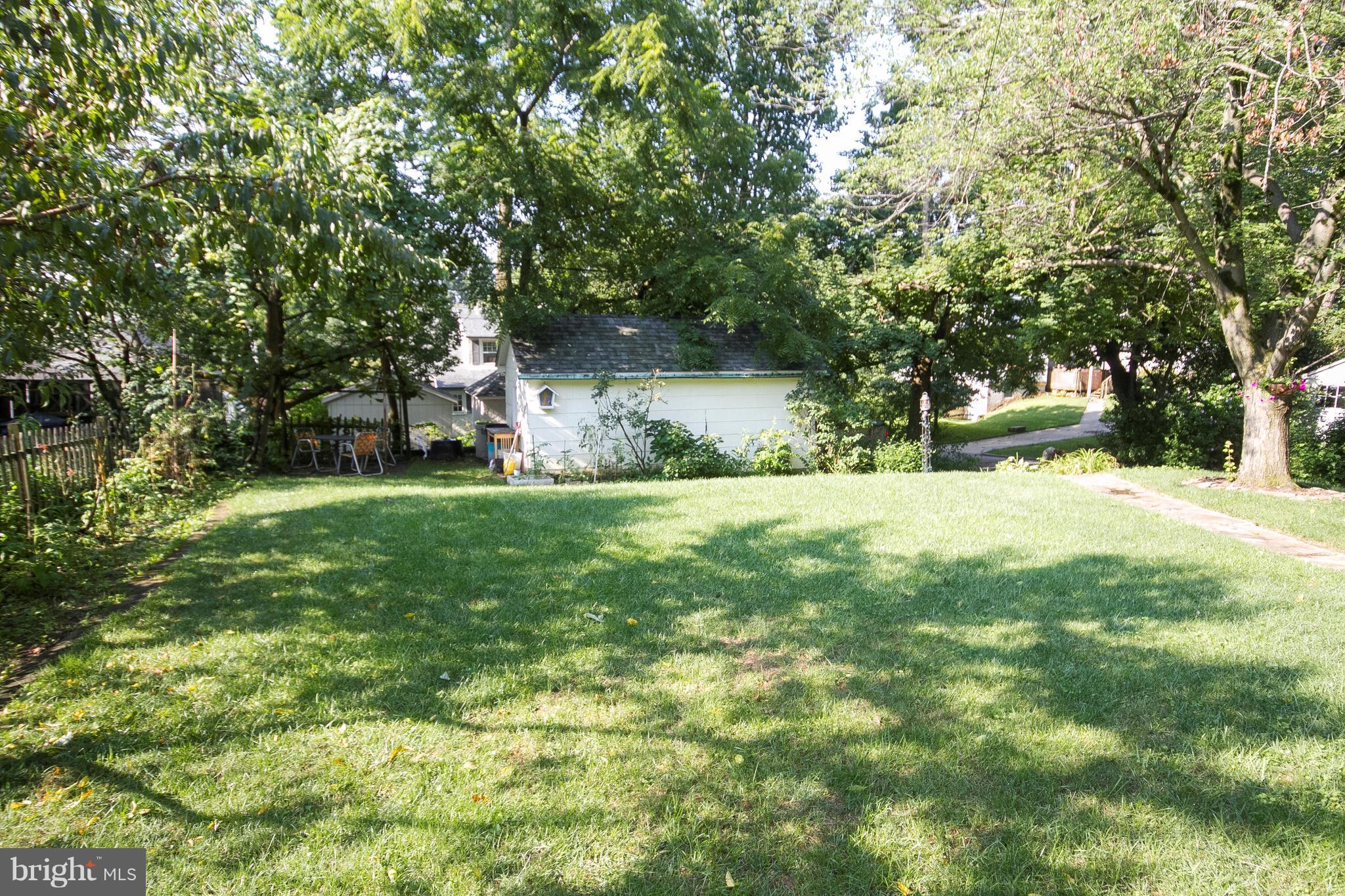 601 Dunkirk Road Baltimore, MD 21212 - Photo 19 of 22 a view of a backyard with a large tree