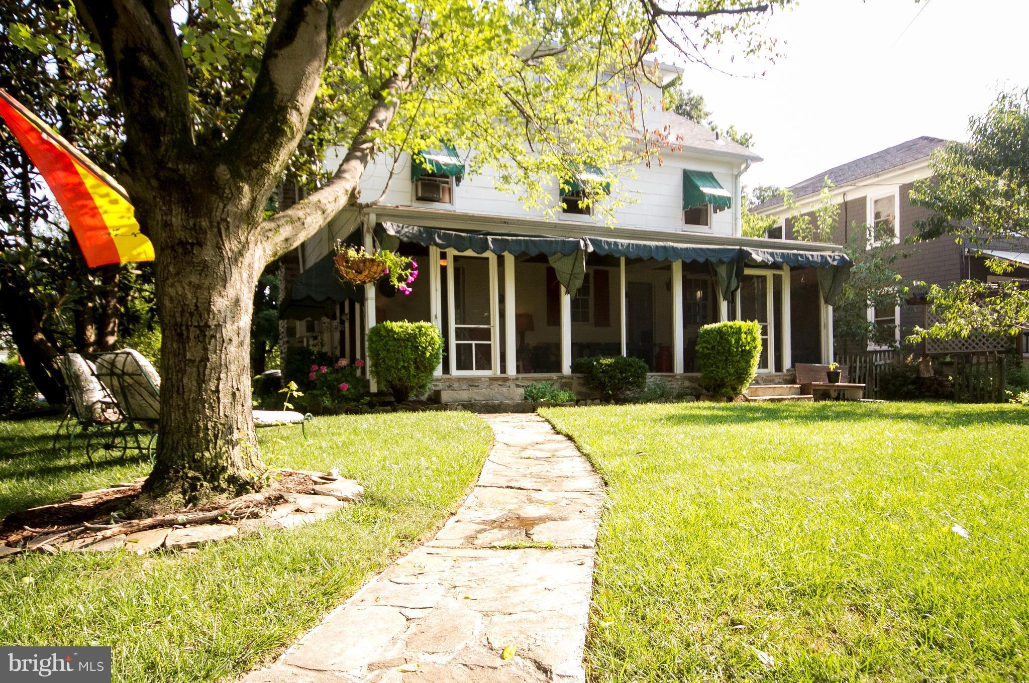 601 Dunkirk Road Baltimore, MD 21212 - Photo 22 of 22 a view of a brick house with a large trees
