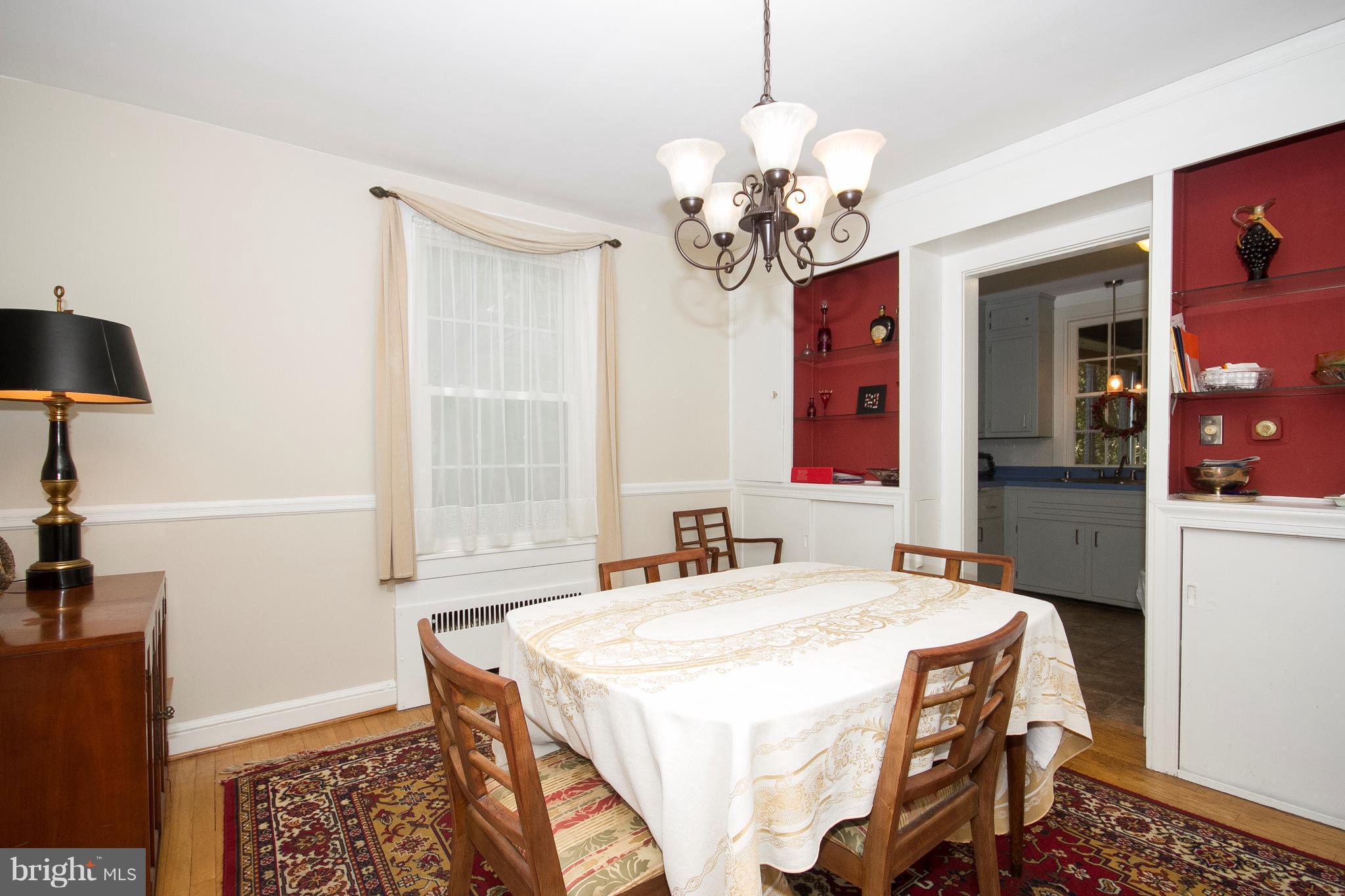 601 Dunkirk Road Baltimore, MD 21212 - Photo 4 of 22 a spacious bedroom with a bed and a chandelier