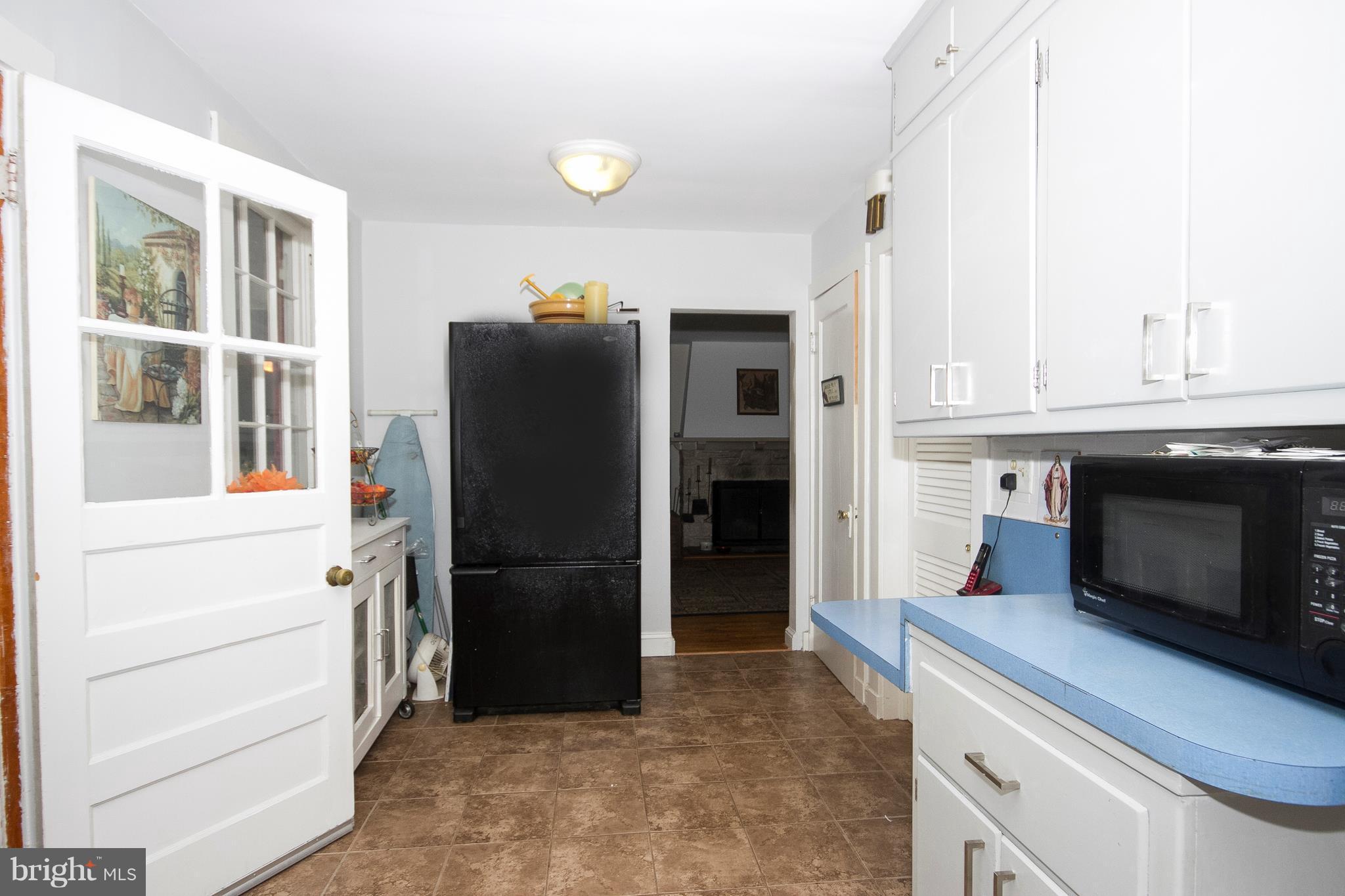 601 Dunkirk Road Baltimore, MD 21212 - Photo 6 of 22 a kitchen with stainless steel appliances a refrigerator and a stove