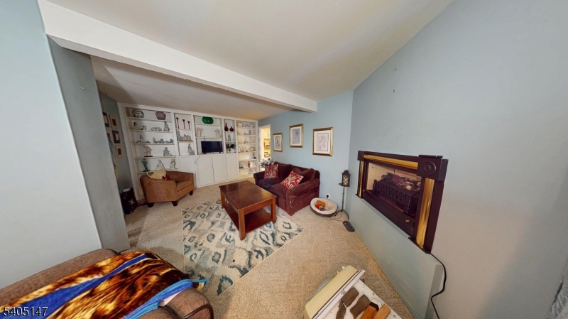 96 Rector Street Millburn, NJ 07041 - Photo 14 of 30 a living room with furniture and a flat screen tv