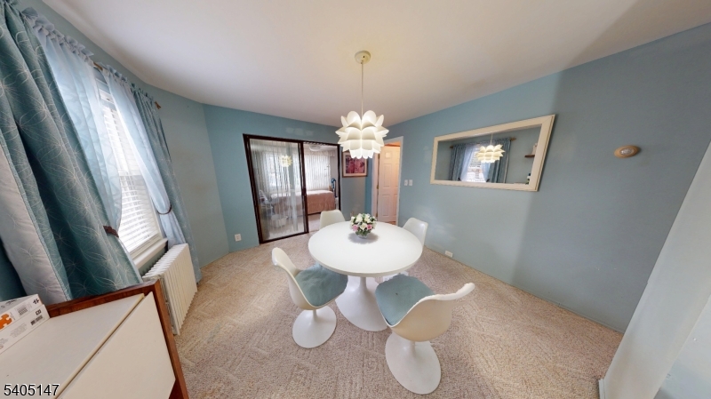 96 Rector Street Millburn, NJ 07041 - Photo 15 of 30 a view of a dining room with furniture and window