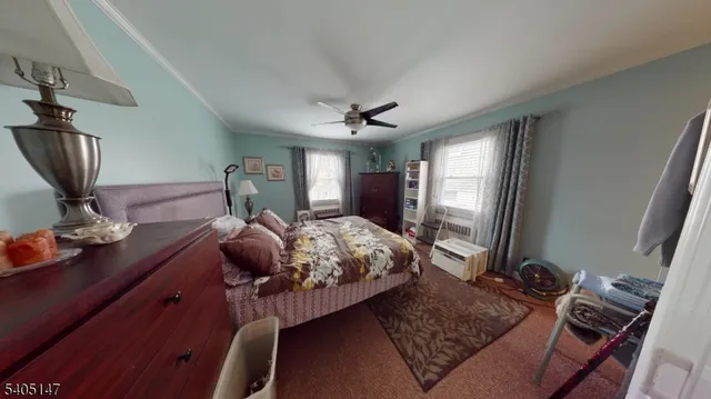 a bed room with a bed and a television