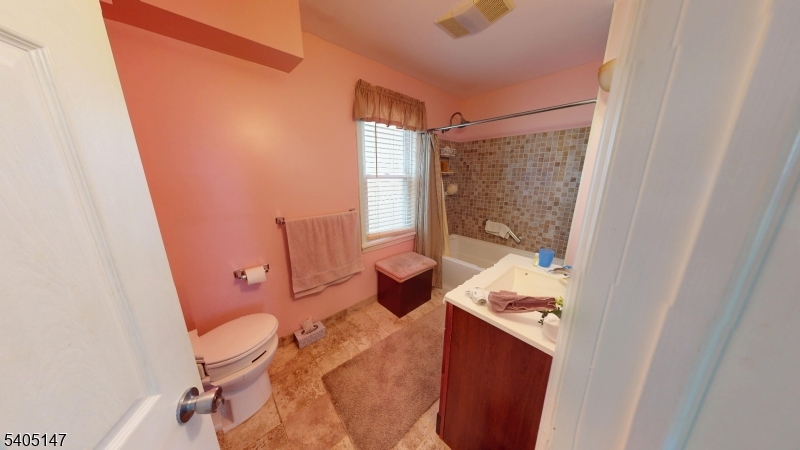 96 Rector Street Millburn, NJ 07041 - Photo 22 of 30 a bathroom with a sink and toilet