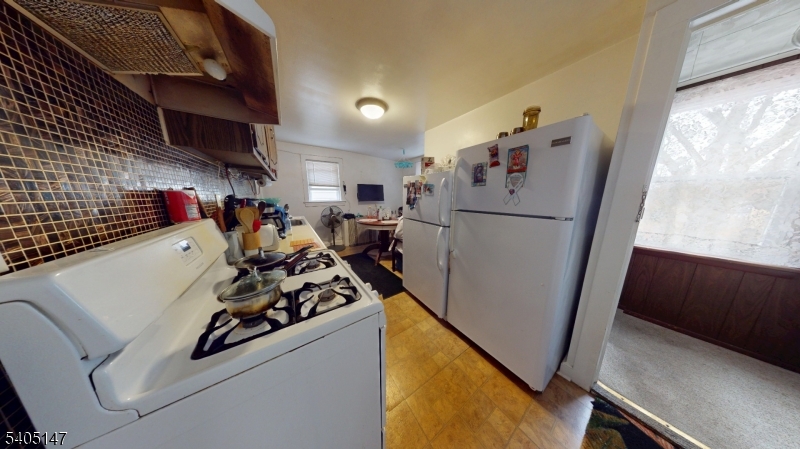 96 Rector Street Millburn, NJ 07041 - Photo 24 of 30 a kitchen with a refrigerator and a stove