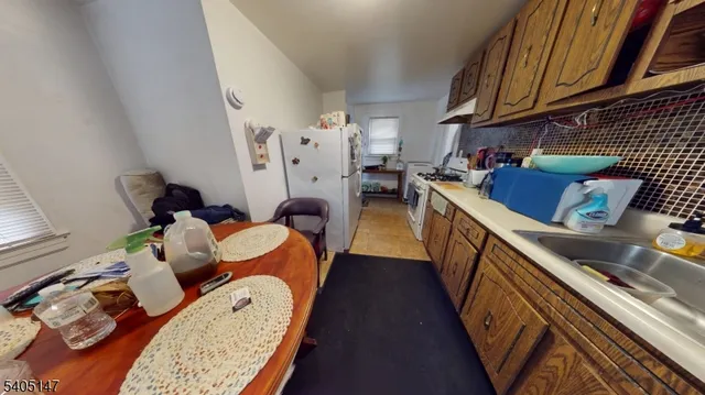 a bed room with a bed and a night stand