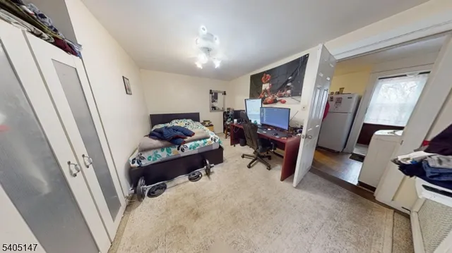 a bathroom with a sink a toilet a window and a mirror