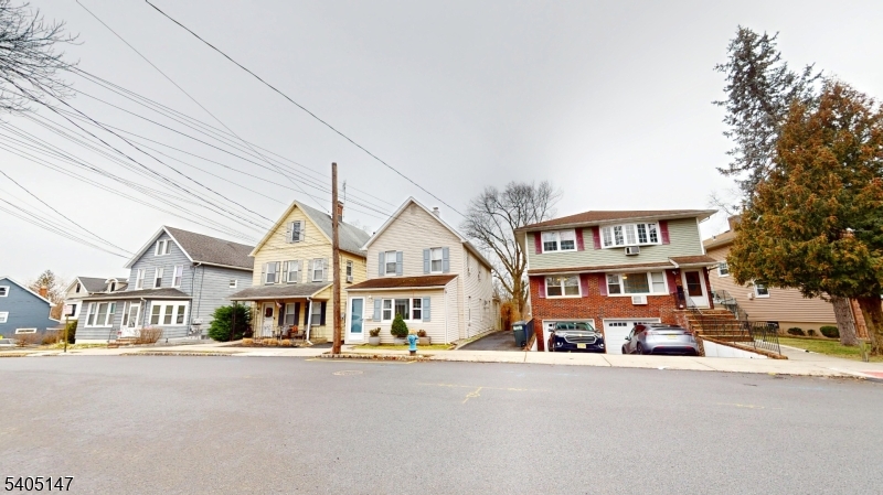 96 Rector Street Millburn, NJ 07041 - Photo 4 of 30 a front view of a residential houses with street
