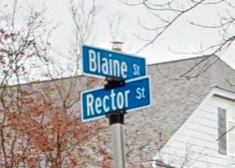 96 Rector Street Millburn, NJ 07041 - Photo 5 of 30 a street sign on a wooden wall