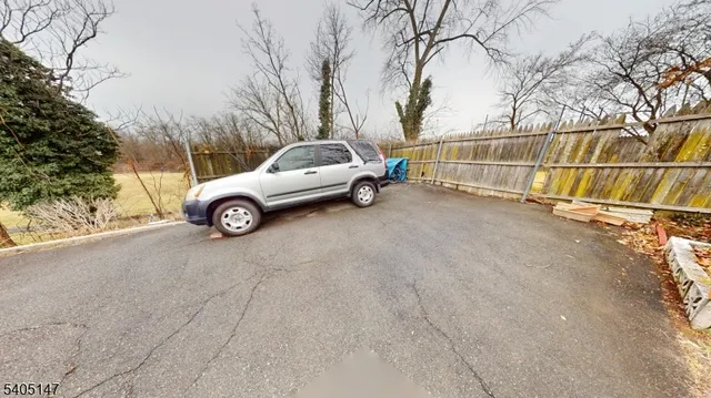 a view of a car parked in front of a house