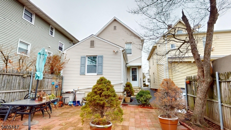 96 Rector Street Millburn, NJ 07041 - Photo 10 of 30 a backyard of a house with outdoor seating