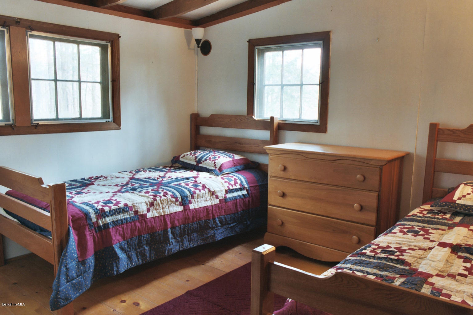 25 Sylvan Road Monterey, MA 01245 - Photo 11 of 17 a bedroom with a bed and wooden floor