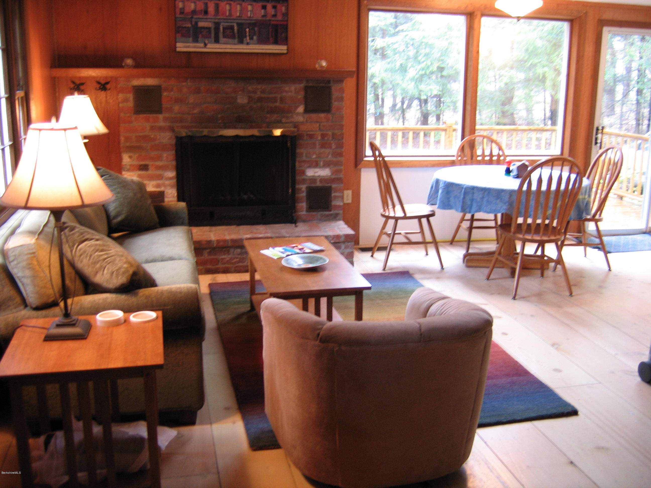 25 Sylvan Road Monterey, MA 01245 - Photo 3 of 17 a living room with furniture a fireplace and a floor to ceiling window