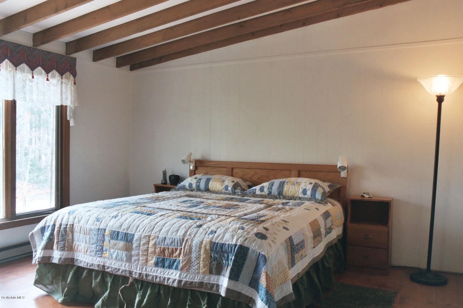 25 Sylvan Road Monterey, MA 01245 - Photo 7 of 17 a bedroom with a bed a window and a mirror