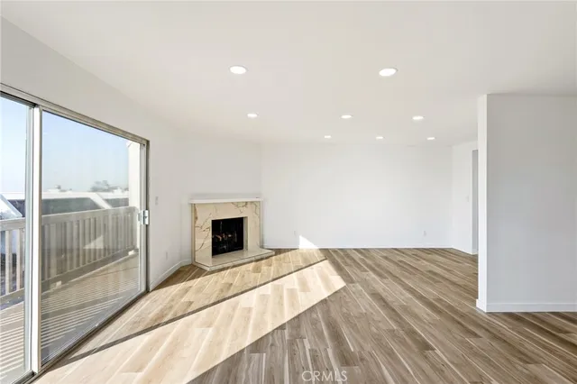 a view of bedroom with wooden floor