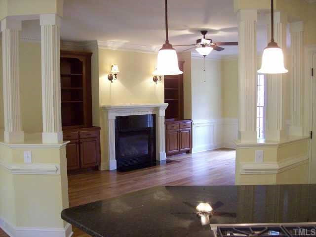 3928 Bending Birch Drive Raleigh, NC 27613 - Photo 6 of 10 looking from behind the bar in the kitchen to the open family room. Family rm has bookcase built-ins plus hardwoods and gas fireplace Other