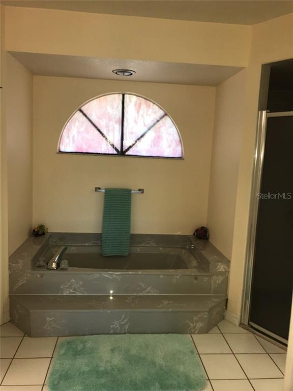 7160 Carlsbad Terrace Englewood, FL 34224 - Photo 11 of 19 a bathroom with a granite countertop sink and a mirror