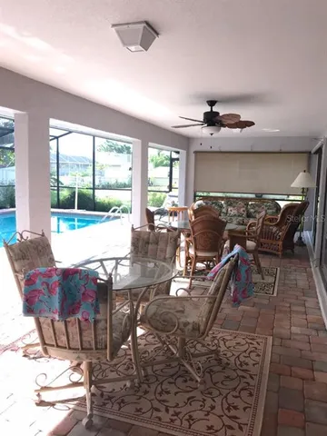 a view of a dining room with furniture window and outside view