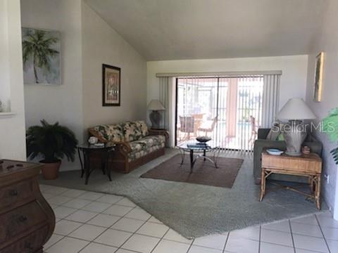 7160 Carlsbad Terrace Englewood, FL 34224 - Photo 2 of 19 a living room with furniture and a large window