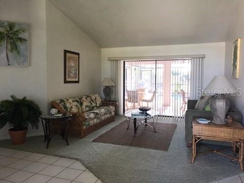 7160 Carlsbad Terrace Englewood, FL 34224 - Photo 3 of 19 a living room with furniture and a large window