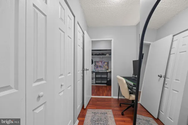 a view of a hallway with a workspace