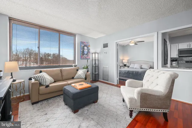 a living room with furniture and a large window